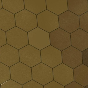 Close-up of a floor with hexagonal brown tiles forming a geometric pattern.